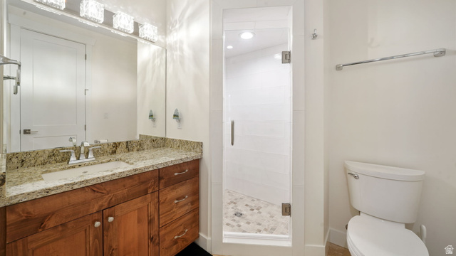 1238 Canyon View Road Midway, UT 84049 - Photo 17 of 36 Bathroom featuring a wood-finish vanity with a granite countertop and integrated sink