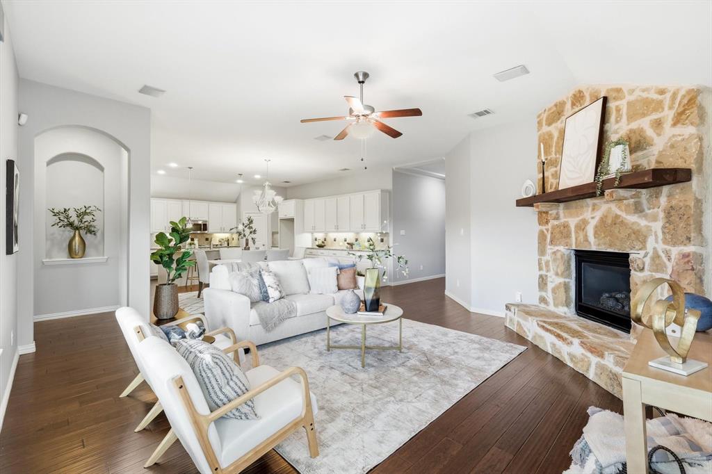 9728 Bitterroot Drive Little Elm, TX 75068 - Photo 4 of 39 Large living space with open concept to dining and kitchen. Natural light, gas fireplace and surround sound with norman shades.