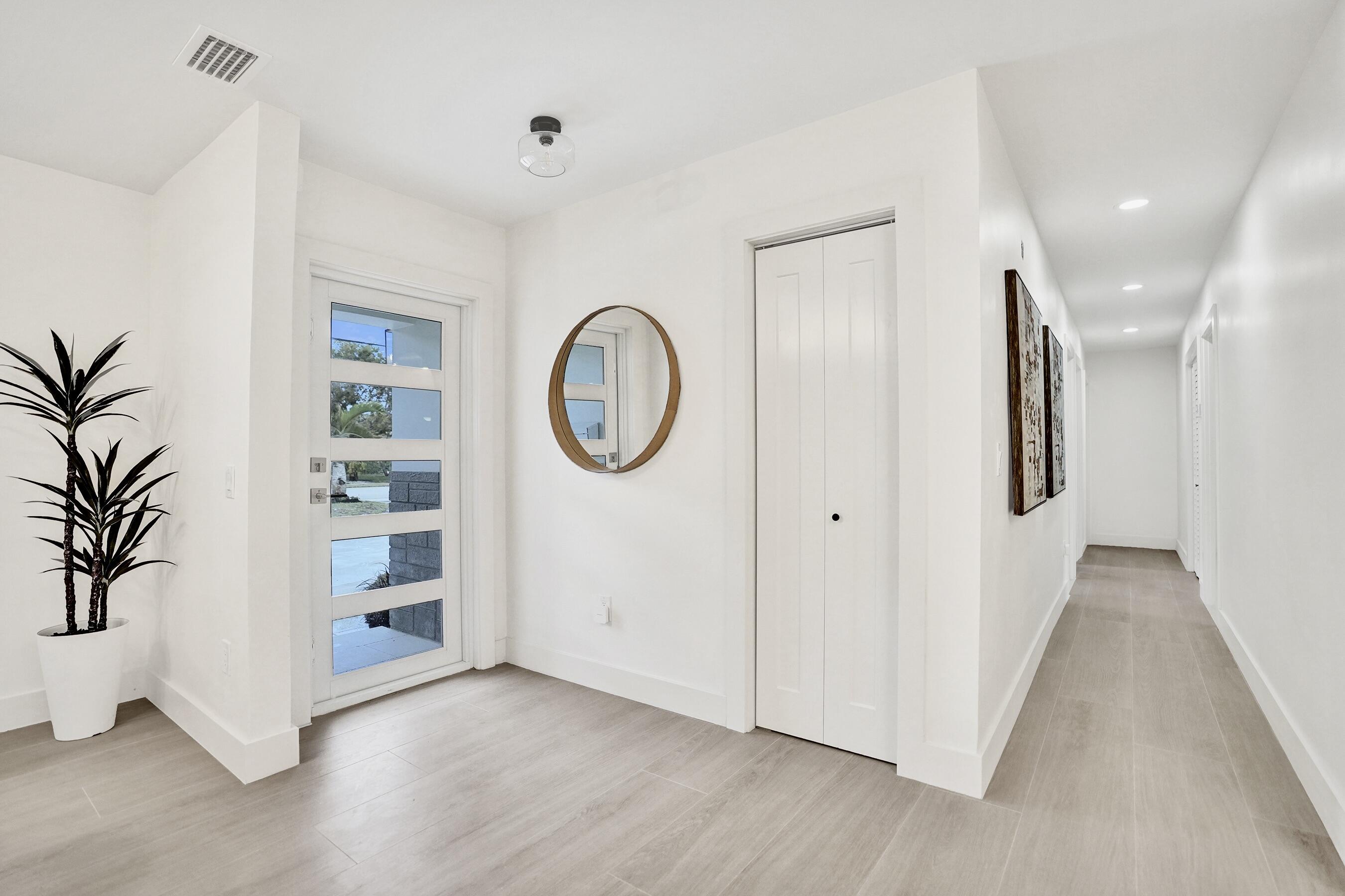 200 Northwest 2nd Street Delray Beach, FL 33444 - Photo 19 of 44 a view of a room with wooden floor and windows