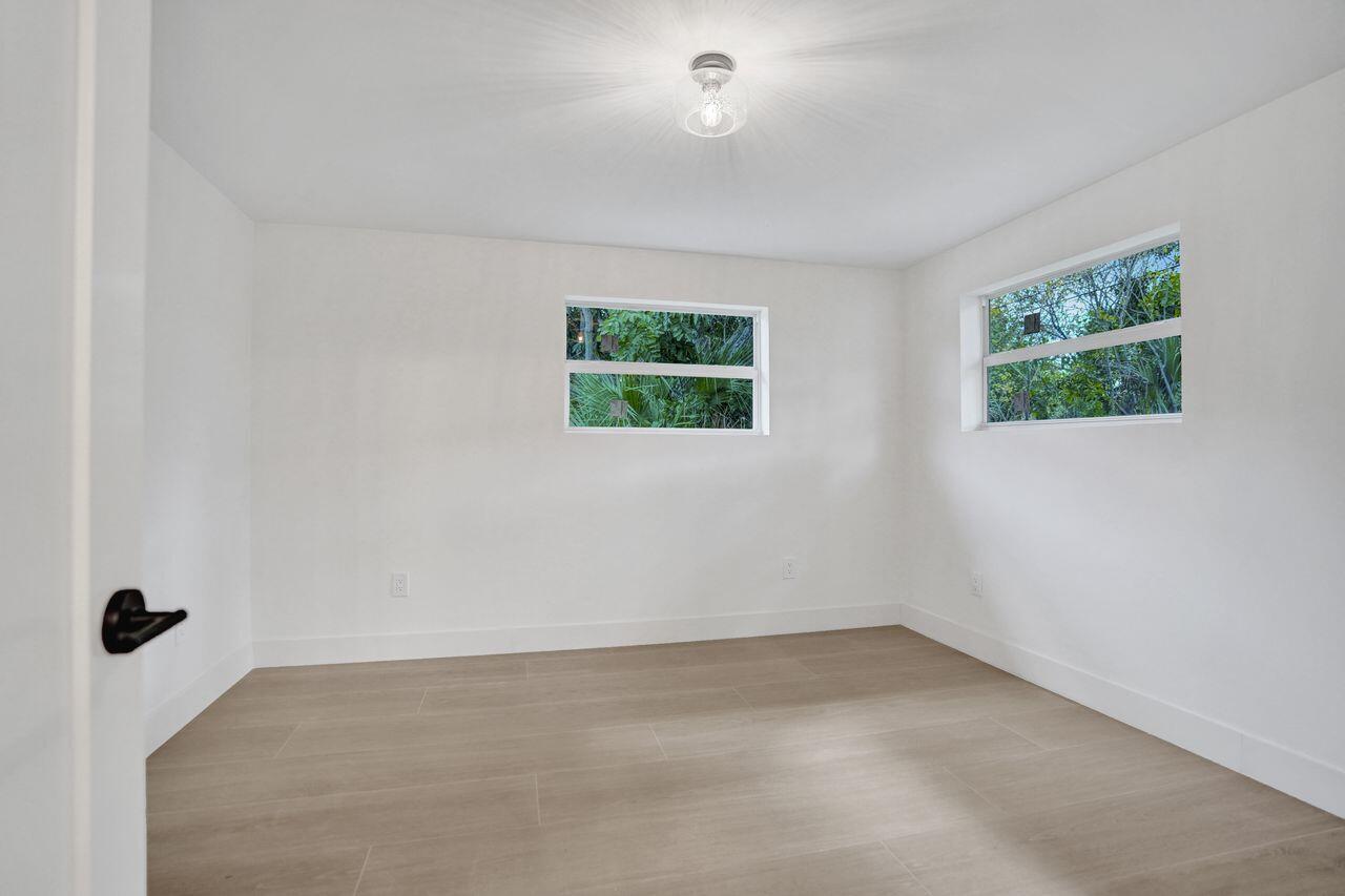 200 Northwest 2nd Street Delray Beach, FL 33444 - Photo 30 of 44 an empty room with windows