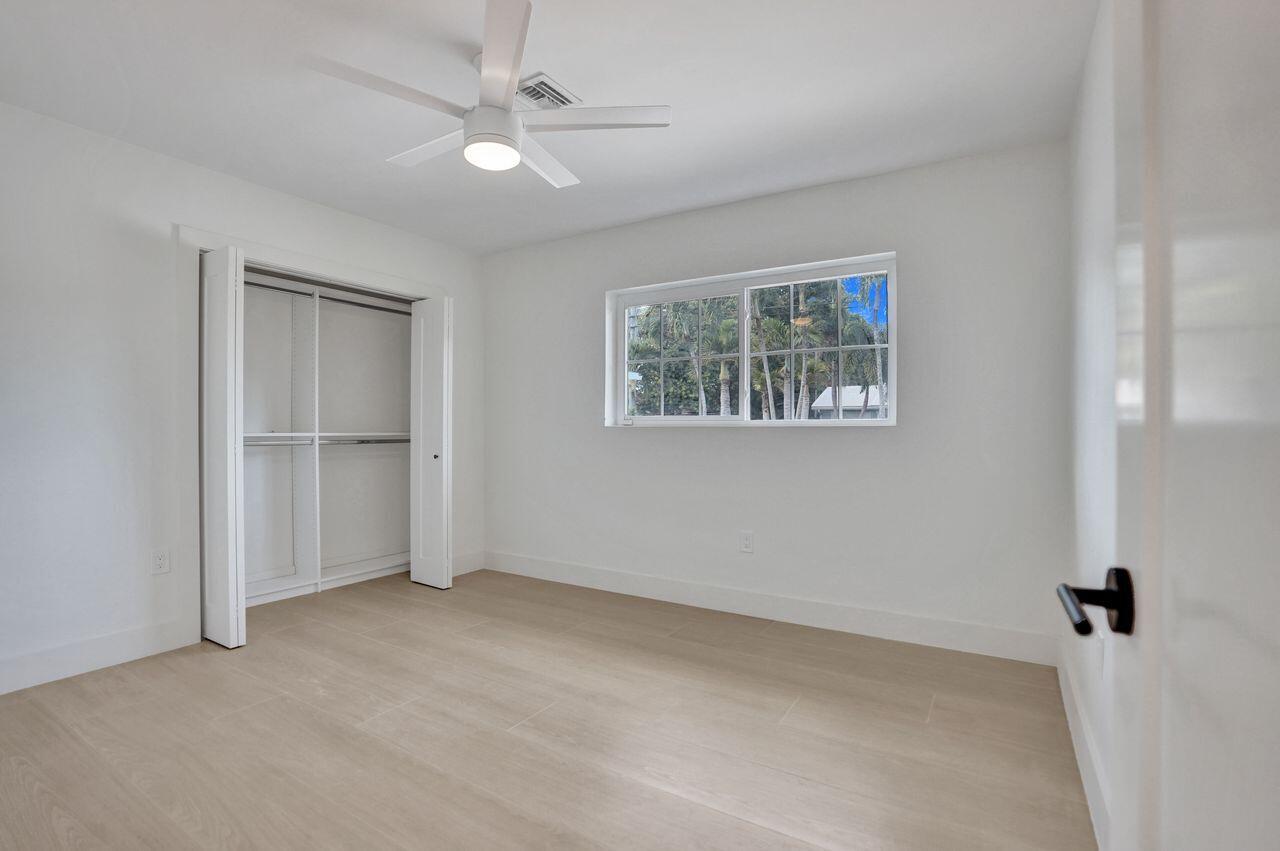 200 Northwest 2nd Street Delray Beach, FL 33444 - Photo 31 of 44 an empty room with windows and cabinet