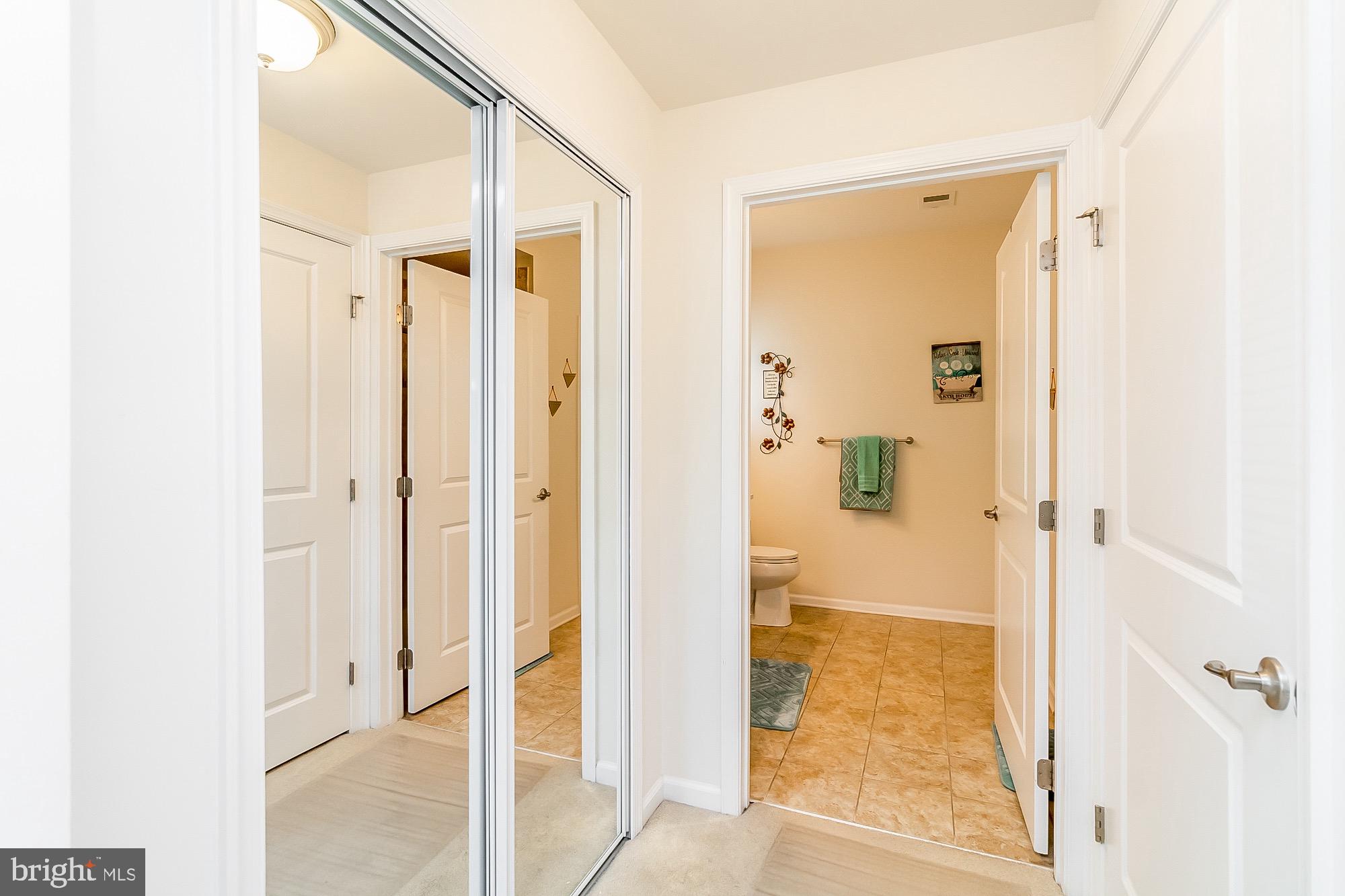 8370 Ice Crystal Drive, Unit E Laurel, MD 20723 - Photo 15 of 34 Closets and hallway to primary bath