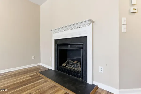 a view of a livingroom and a fireplace