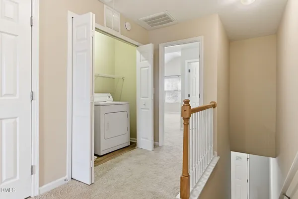 a view of a bathroom with a shower and a sink