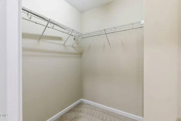 a view of a room with racks on the wall