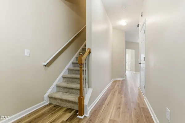 a view of entryway with wooden floor
