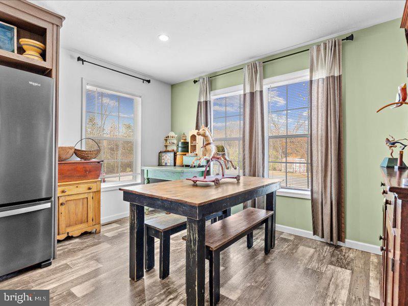 501 Windy Hill Road Shermans Dale, PA 17090 - Photo 11 of 26 a view of a dining room with furniture window and wooden floor