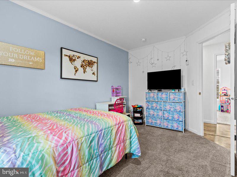 501 Windy Hill Road Shermans Dale, PA 17090 - Photo 19 of 26 a bedroom with a bed and a flat screen tv