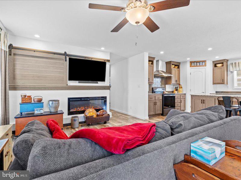 501 Windy Hill Road Shermans Dale, PA 17090 - Photo 6 of 26 a living room with furniture and a flat screen tv