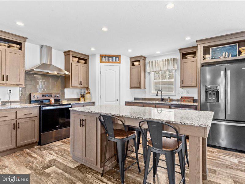 501 Windy Hill Road Shermans Dale, PA 17090 - Photo 7 of 26 a kitchen with a table chairs refrigerator and cabinets