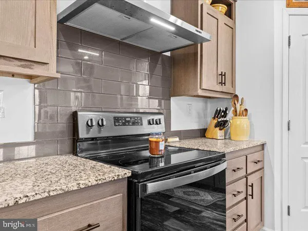 a kitchen with a stove and a sink