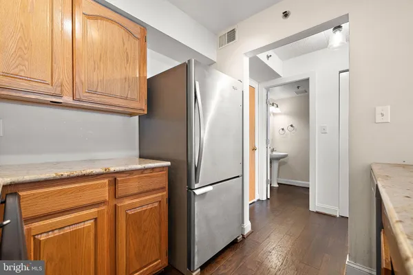 a kitchen with stainless steel appliances granite countertop a sink stove and microwave