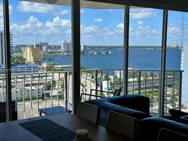 a living room with large windows