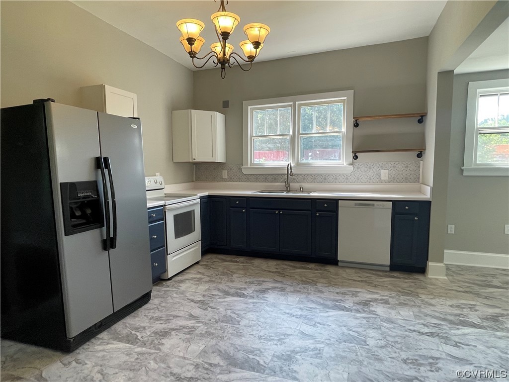 2404 Springston Road Wilsons, VA 23894 - Photo 9 of 36 a kitchen with stainless steel appliances granite countertop a sink and a refrigerator