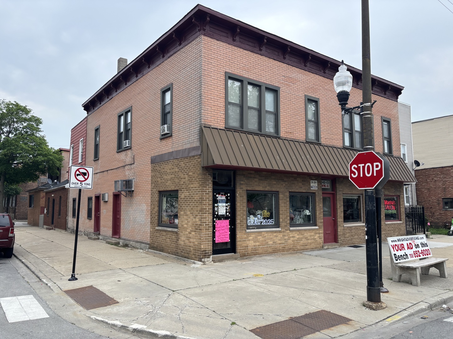 10401 South Ewing Avenue, Unit 104032 Chicago, IL 60617 - Photo 2 of 10 a view of a brick house with large windows