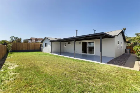 a view of a house with a yard and garage