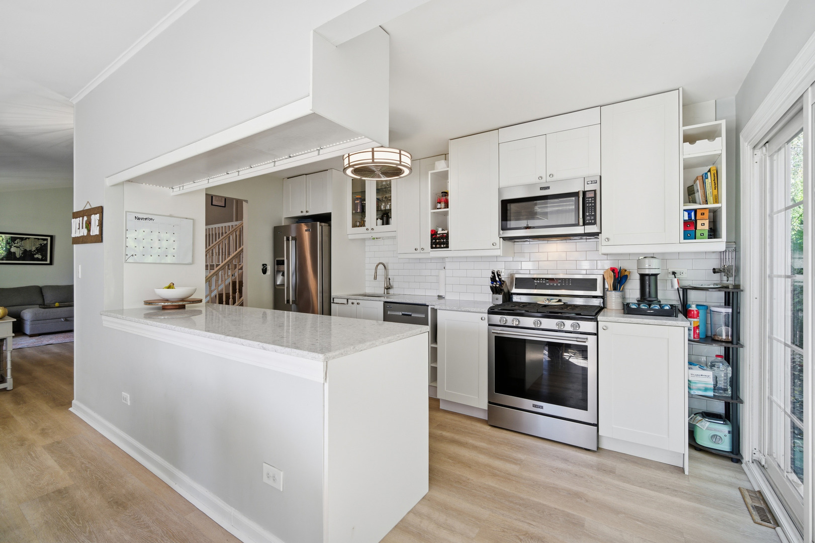 484 Chatham Circle Buffalo Grove, IL 60089 - Photo 11 of 28 a kitchen with kitchen island a white cabinets and refrigerator