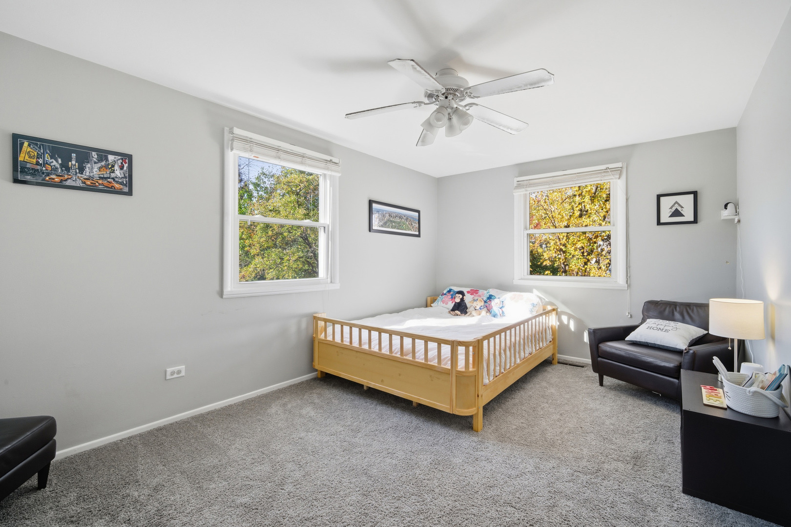 484 Chatham Circle Buffalo Grove, IL 60089 - Photo 17 of 28 a room with a bed and a chandelier