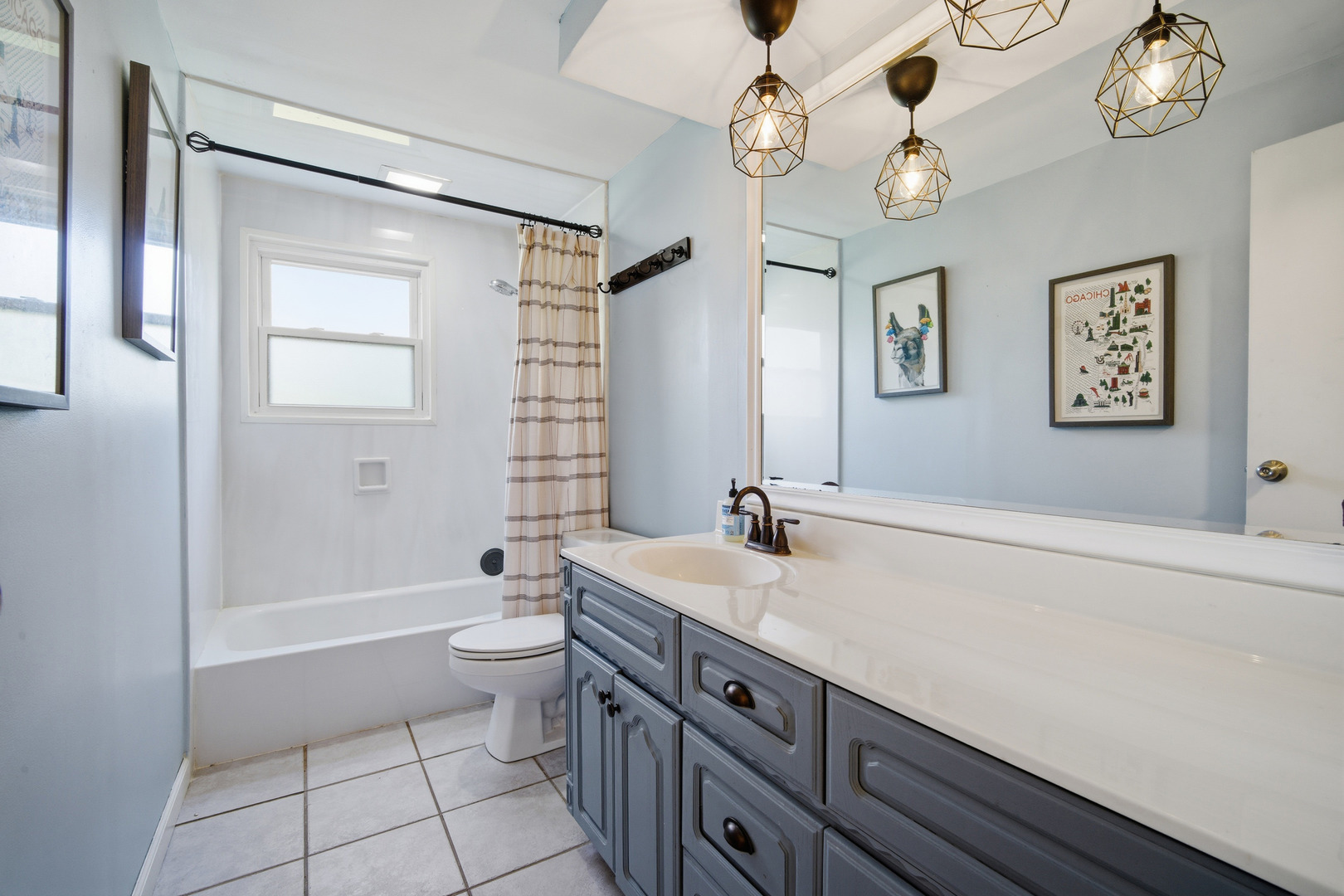 484 Chatham Circle Buffalo Grove, IL 60089 - Photo 19 of 28 a spacious bathroom with a granite countertop sink a toilet a mirror a vanity a bathtub and shower