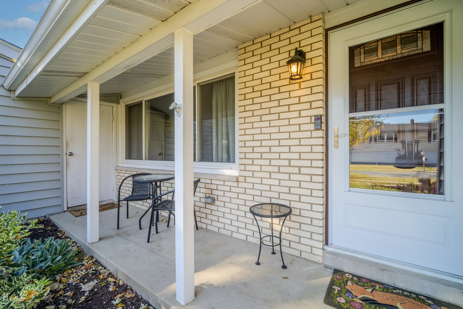 484 Chatham Circle Buffalo Grove, IL 60089 - Photo 2 of 28 a view of a patio with table and chairs and potted plants