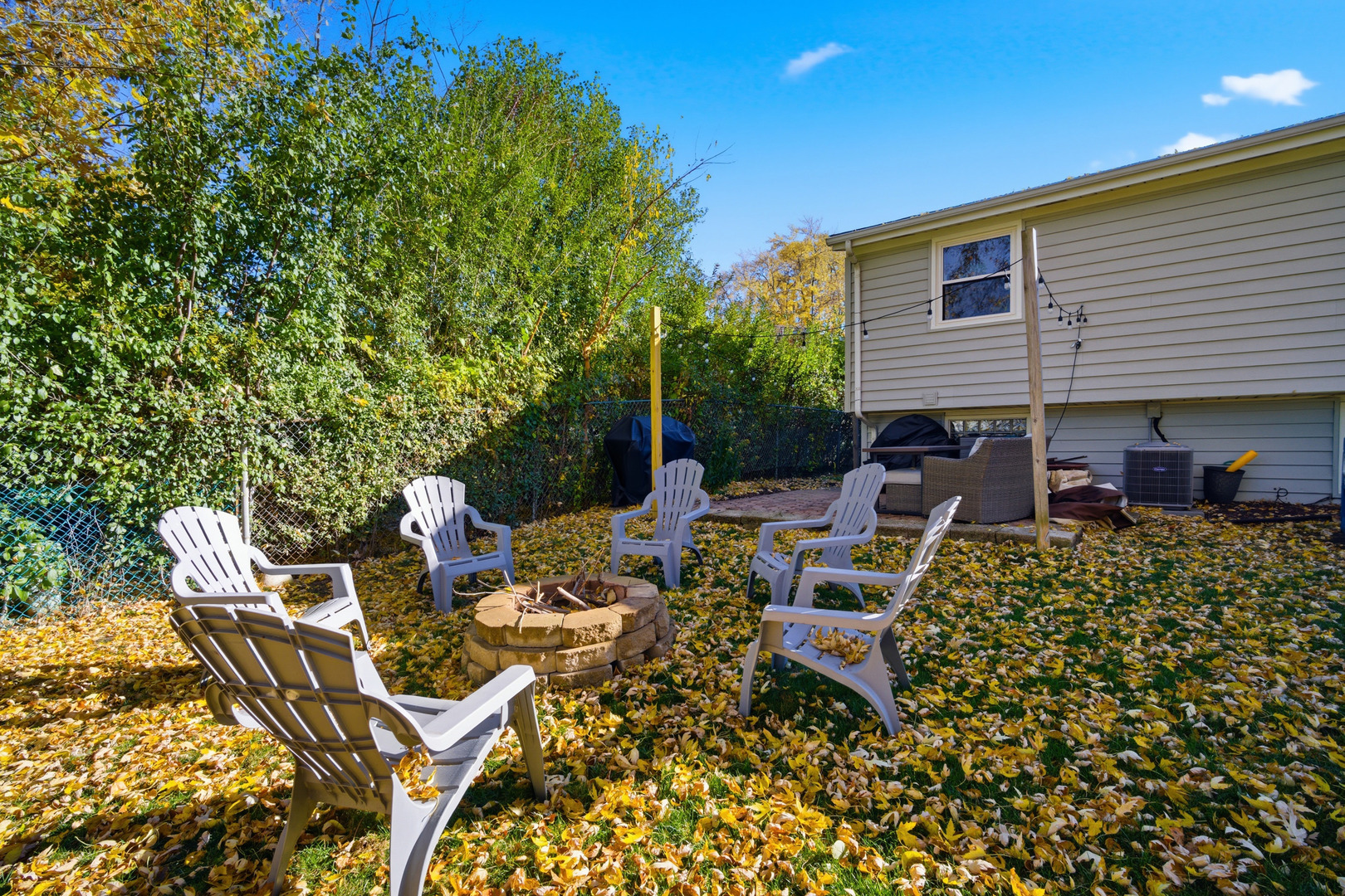 484 Chatham Circle Buffalo Grove, IL 60089 - Photo 26 of 28 a view of a patio with table and chairs and potted plants