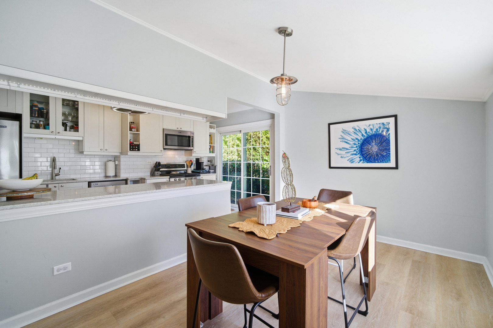 484 Chatham Circle Buffalo Grove, IL 60089 - Photo 8 of 28 a view of a dining room with furniture window and wooden floor