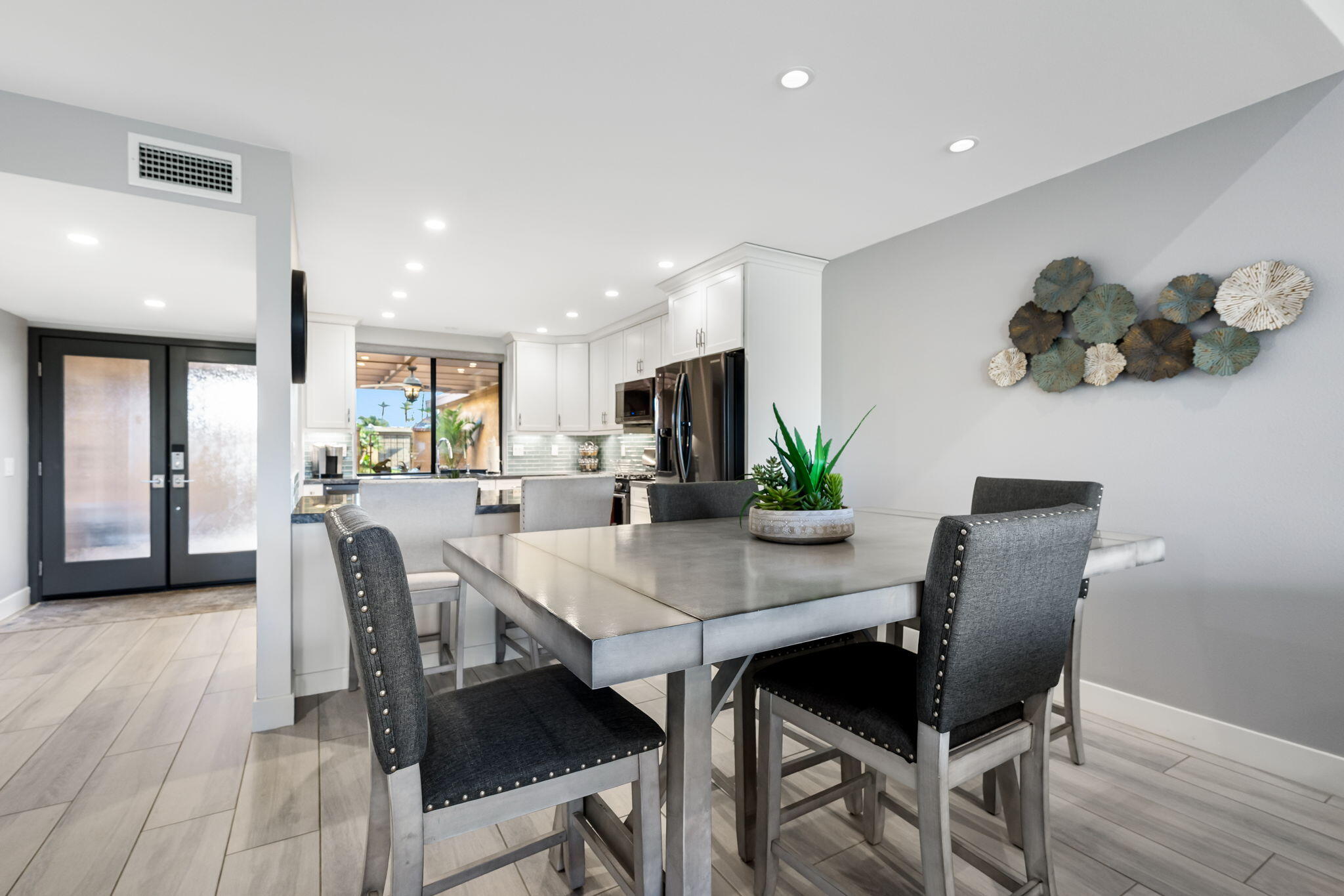 10 Palma Drive Rancho Mirage, CA 92270 - Photo 16 of 51 a view of a dining room with furniture and wooden floor
