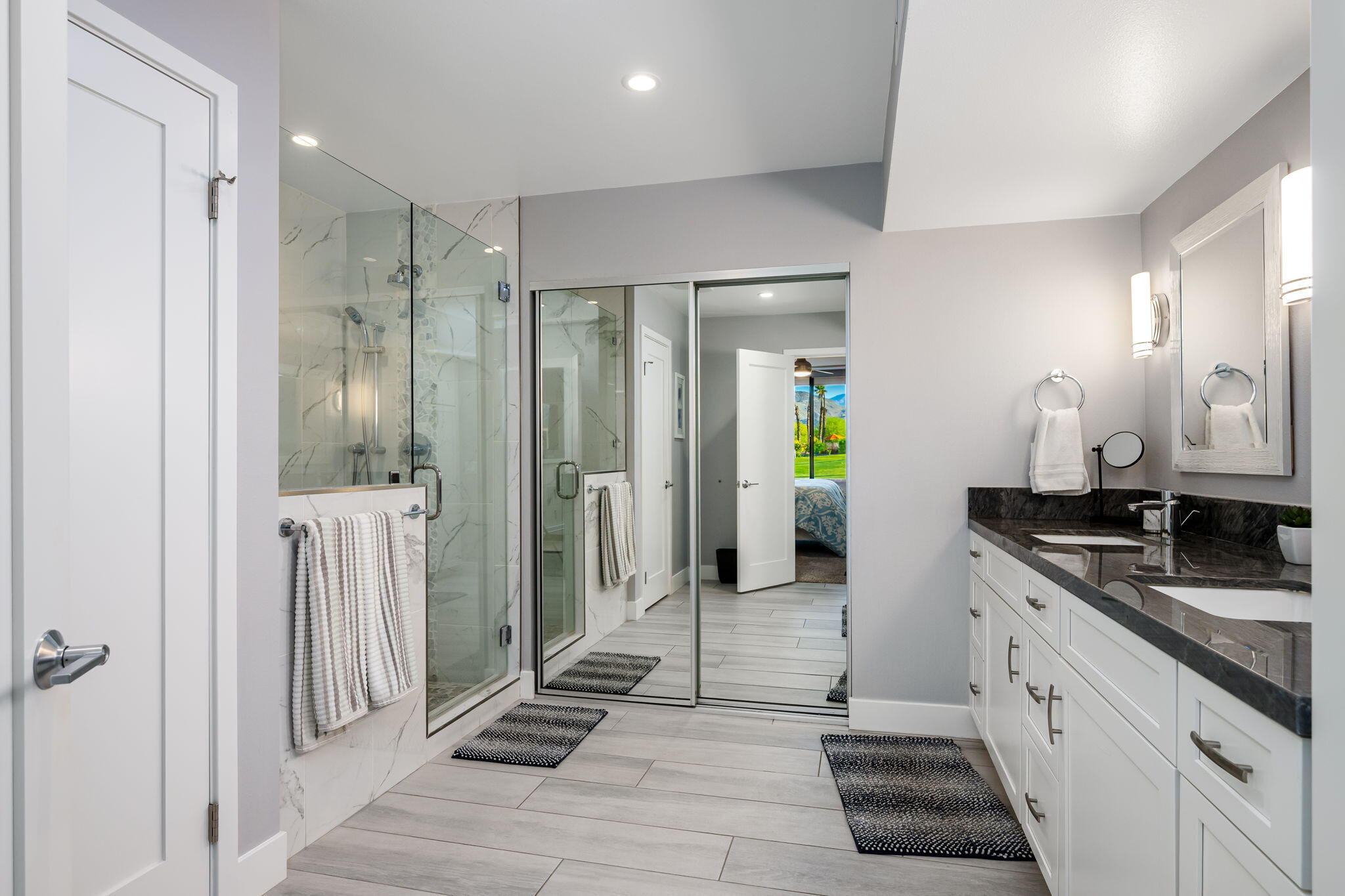 10 Palma Drive Rancho Mirage, CA 92270 - Photo 24 of 51 a spacious bathroom with a granite countertop sink mirror and shower