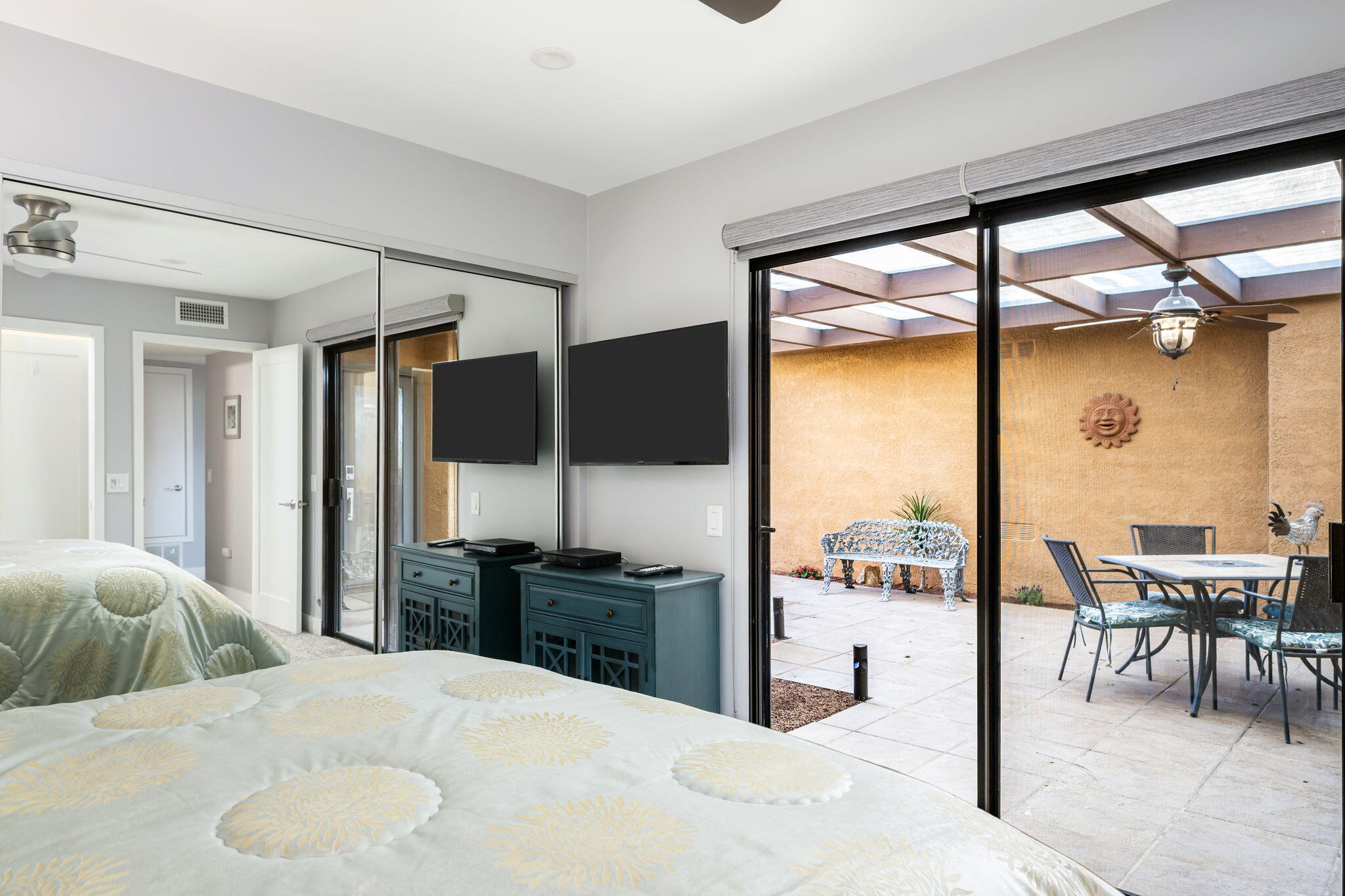 10 Palma Drive Rancho Mirage, CA 92270 - Photo 27 of 51 a bedroom with a large window and a table