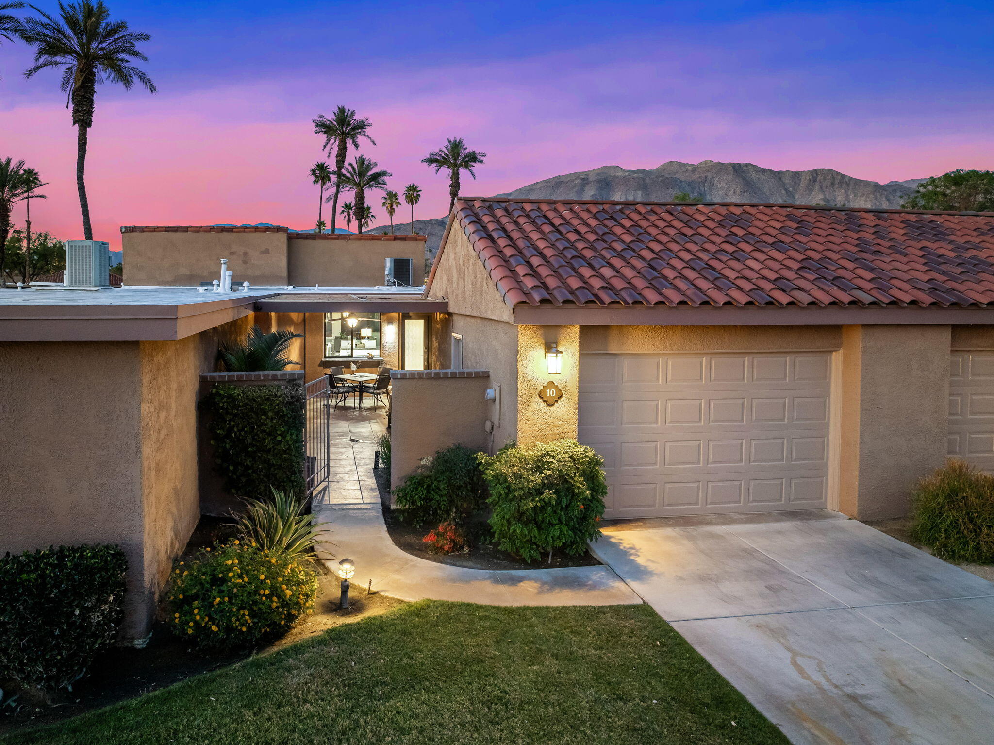 10 Palma Drive Rancho Mirage, CA 92270 - Photo 3 of 51 a front view of a house with a yard