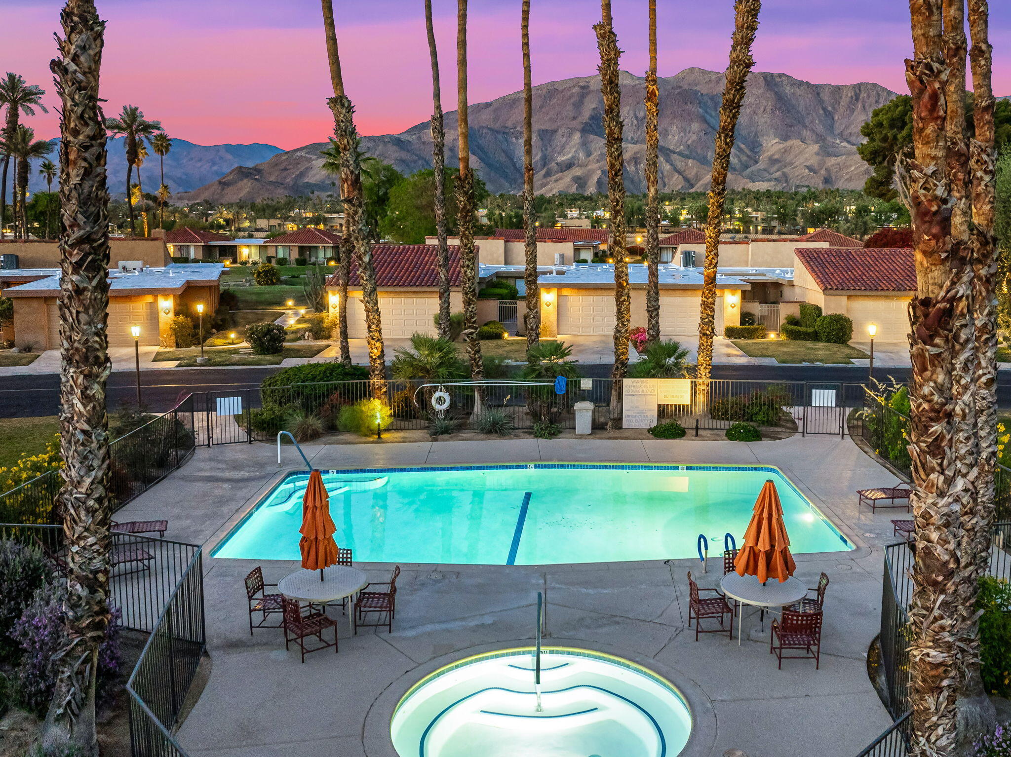 10 Palma Drive Rancho Mirage, CA 92270 - Photo 43 of 51 a backyard of a house with table and chairs