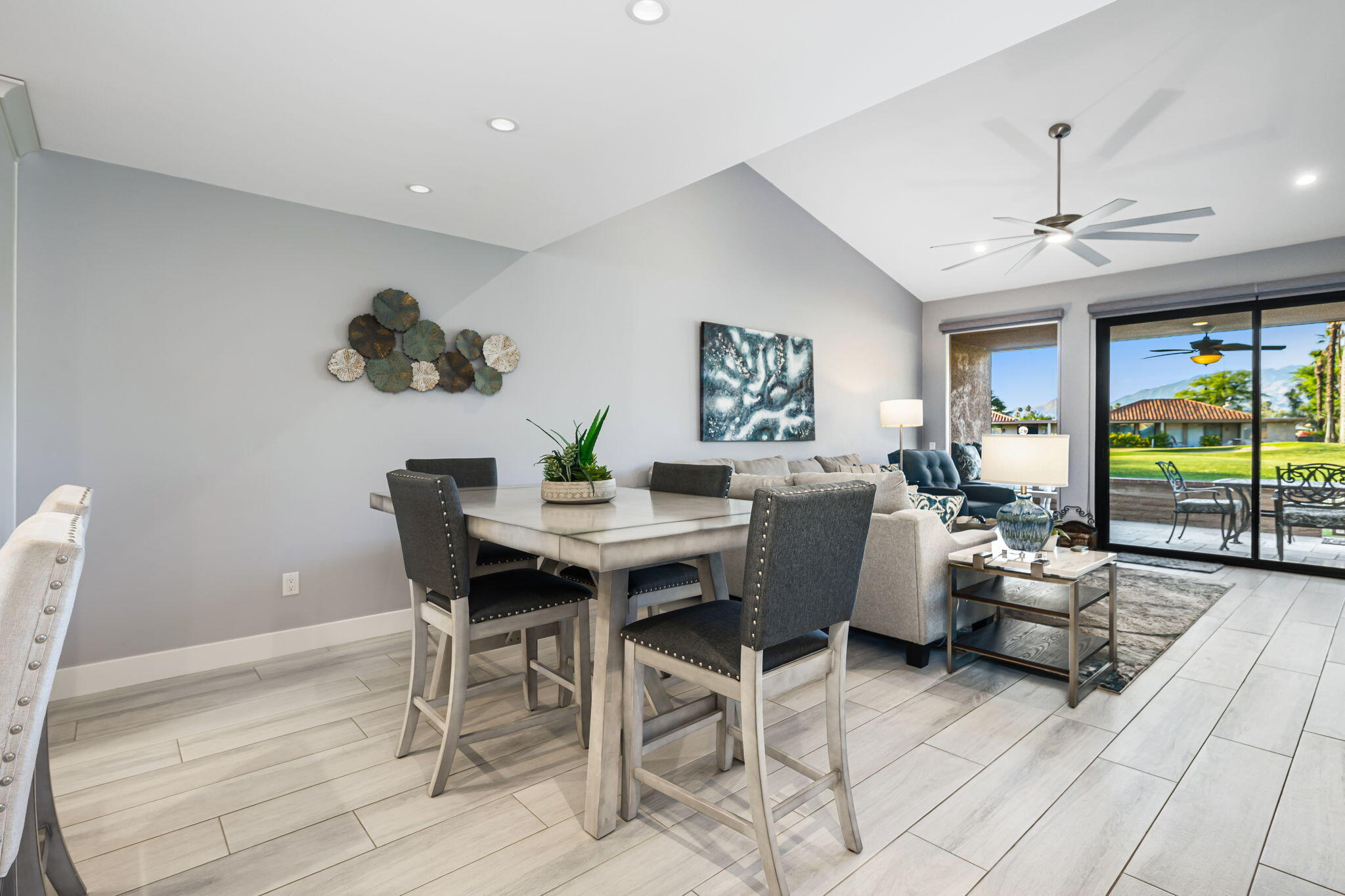 10 Palma Drive Rancho Mirage, CA 92270 - Photo 8 of 51 a view of a dining room with furniture a chandelier and wooden floor