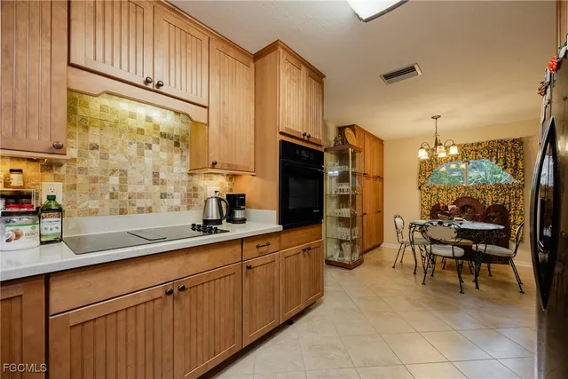 a kitchen with stainless steel appliances a sink and cabinets