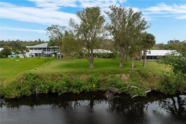 a view of a lake with a building in front of it