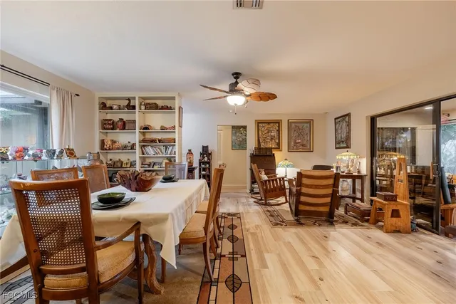 a view of a dining room with furniture and wooden floor