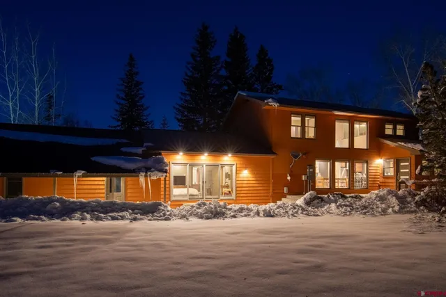 a view of a house that has a street