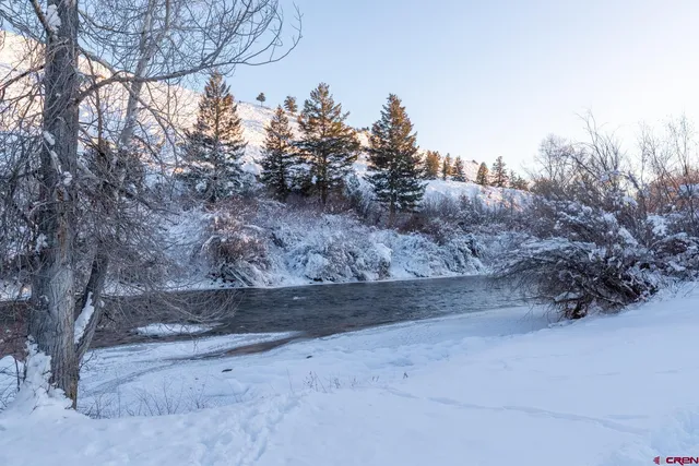 a blue bench sitting in front of a house