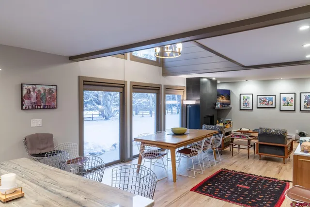 a room with furniture a rug and a window