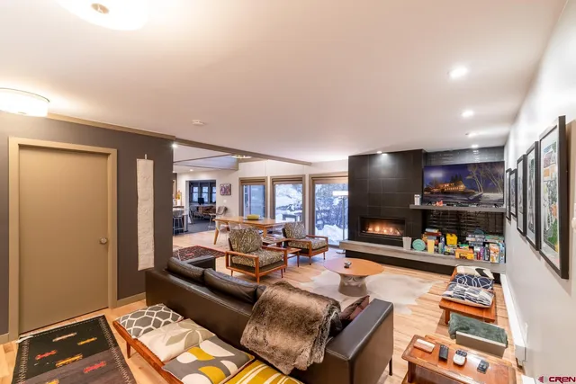 a living room with furniture and a flat screen tv