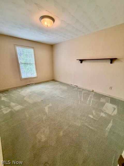 165 Mathews Road, Unit A Youngstown, OH 44512 - Photo 9 of 17 Room featuring neutral wall tones, a single window, and a built-in shelf