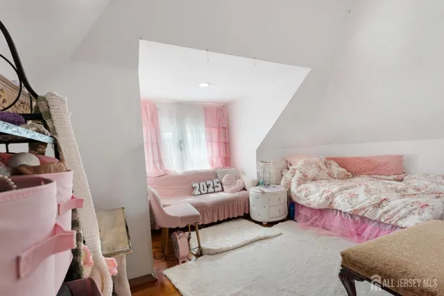 a spacious bedroom with a bed and a couch