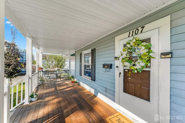 a living room filled with furniture and a potted plant
