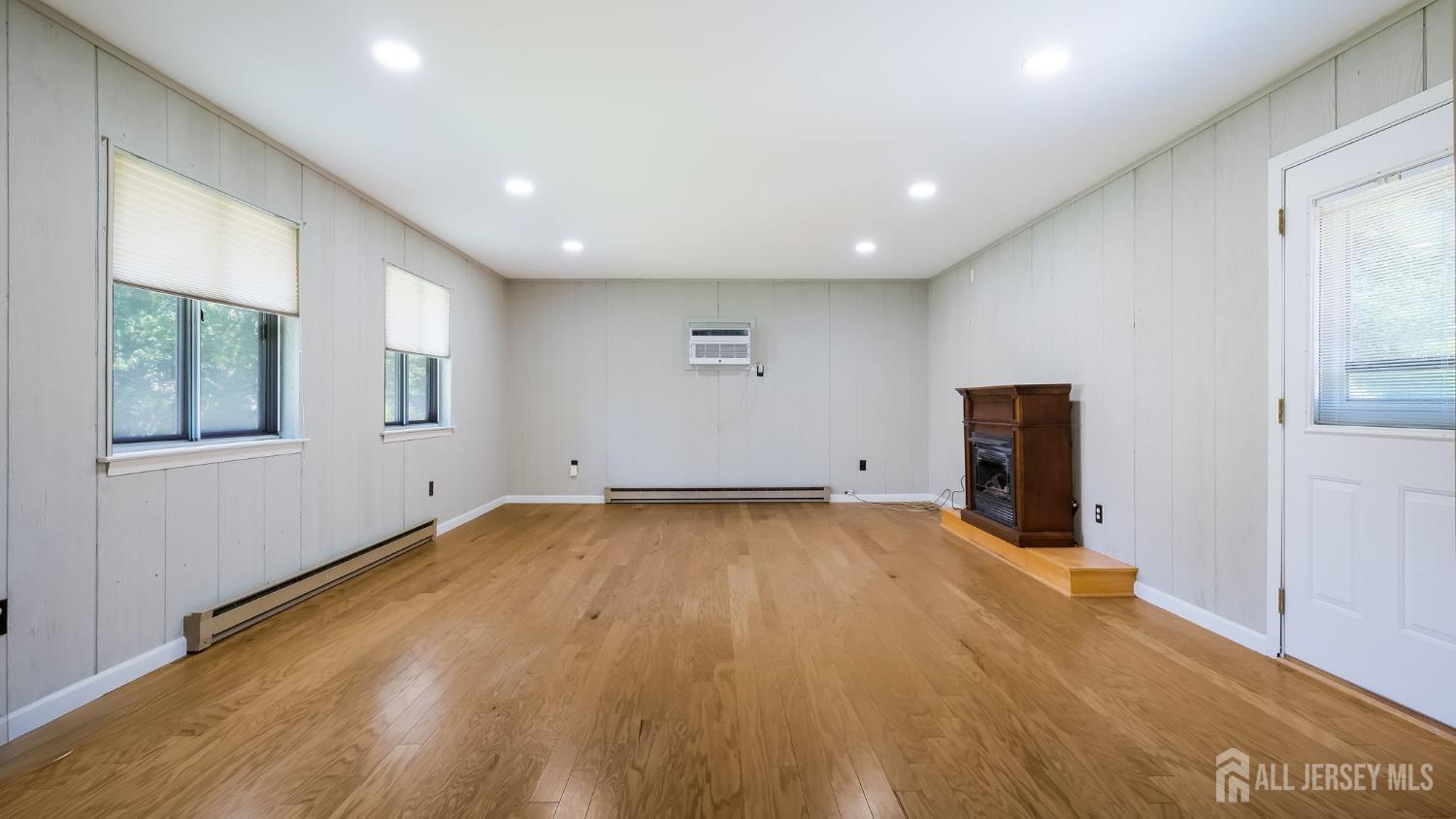 50 Sand Hills Road Kendall Park, NJ 08824 - Photo 6 of 27 a view of a room with wooden floor and window