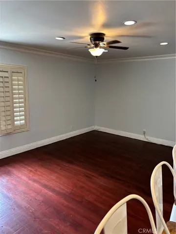 an empty room with wooden floor