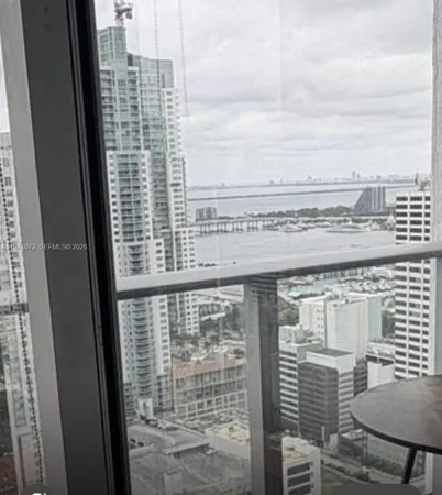 a view of a balcony next to a yard