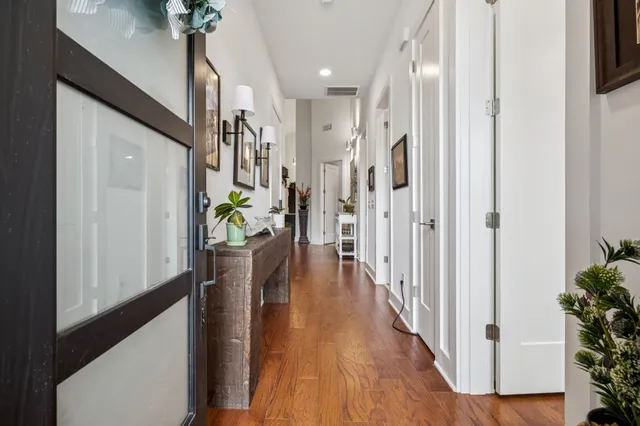 a view of entryway with livingroom and wooden floor