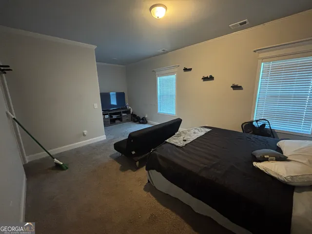 a bedroom with a bed and furniture