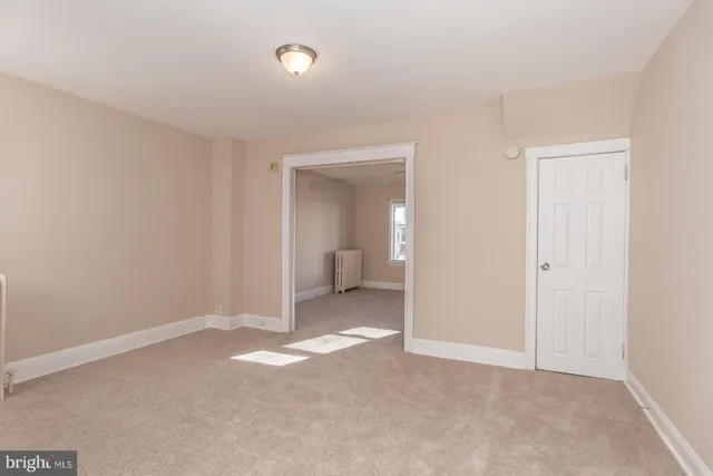 a kitchen with cabinets appliances a sink and a window