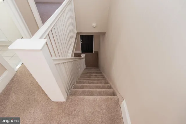 a view of a hallway with a wooden floor