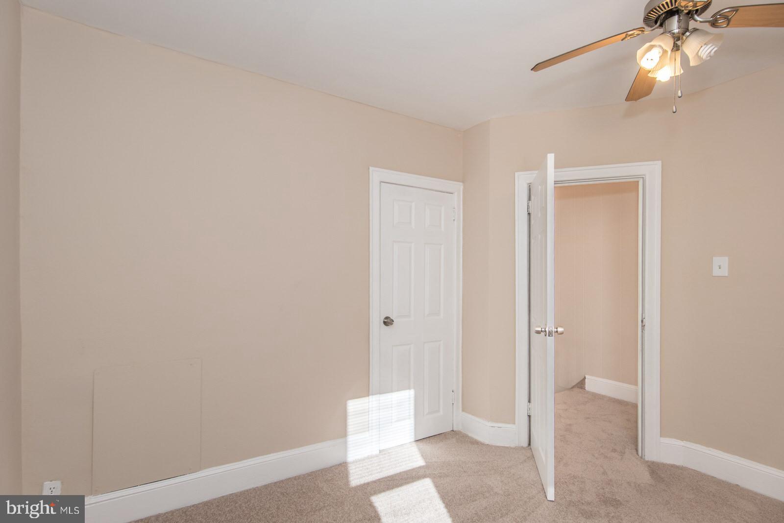 7119 Gillespie Street Philadelphia, PA 19135 - Photo 26 of 47 a view of a livingroom with a chandelier fan and closet